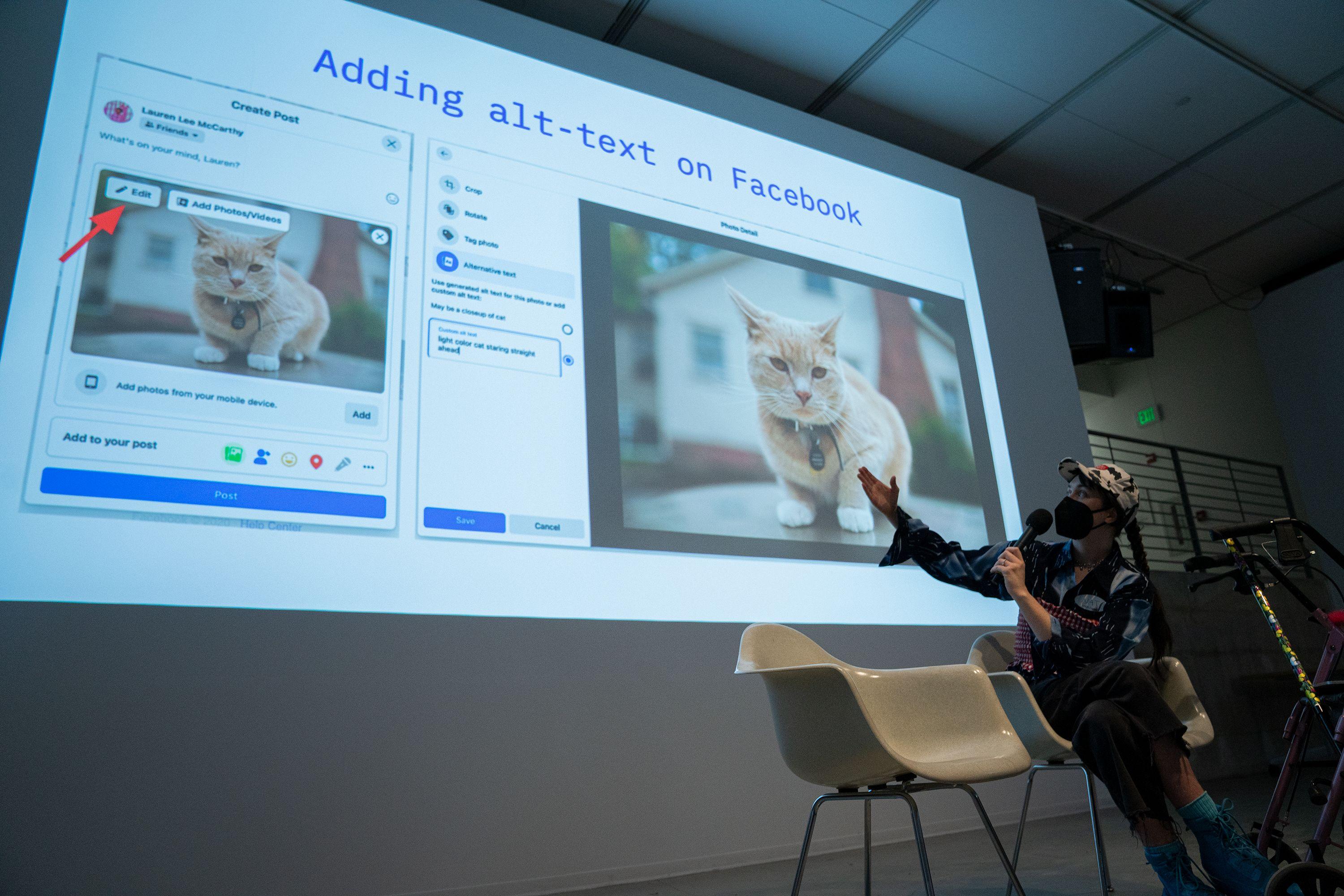 a seated person with microphone gestures toward projection with info about adding alt-text on facebook