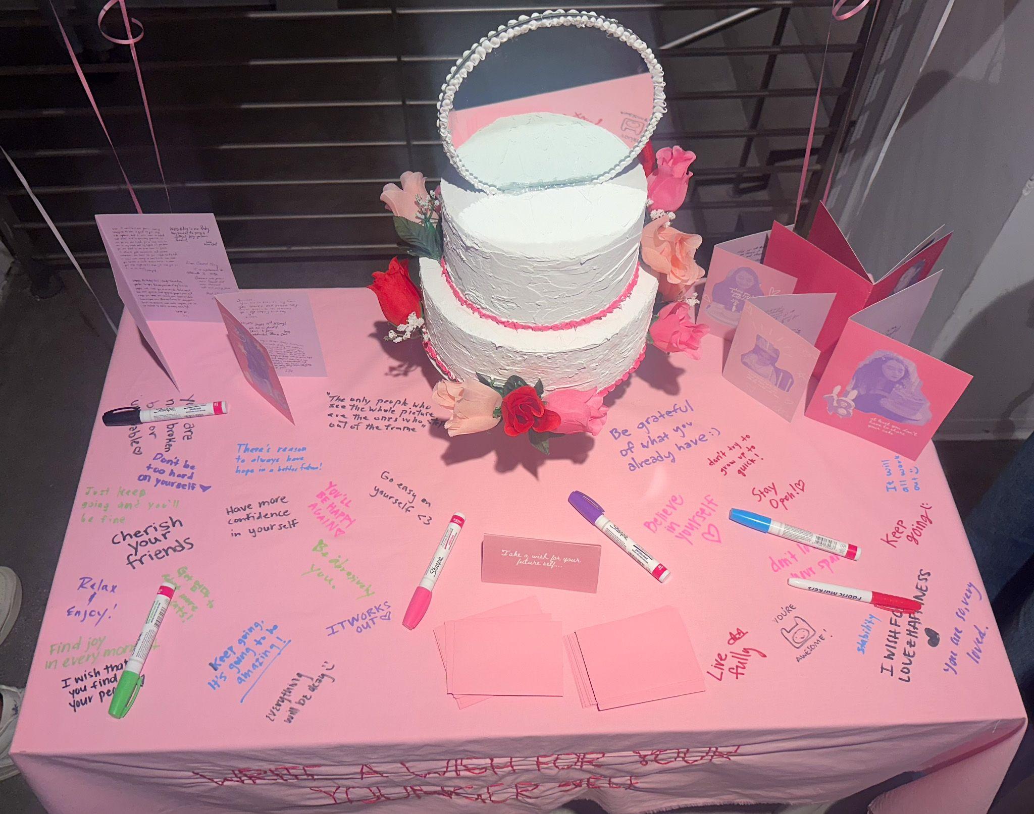 A close up image of the table, with wishes written all over the table cover.