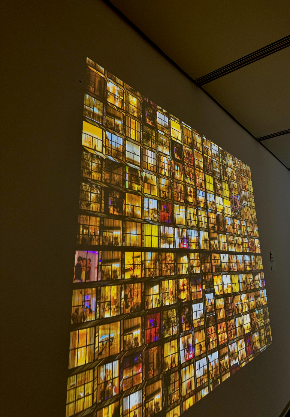 A projection of the cube shaped grid on the gallery wall.